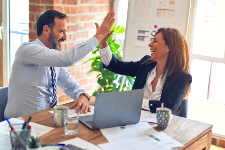 Why Marketing Efforts Fail Without a Strong Sales Strategy man and woman high fiving