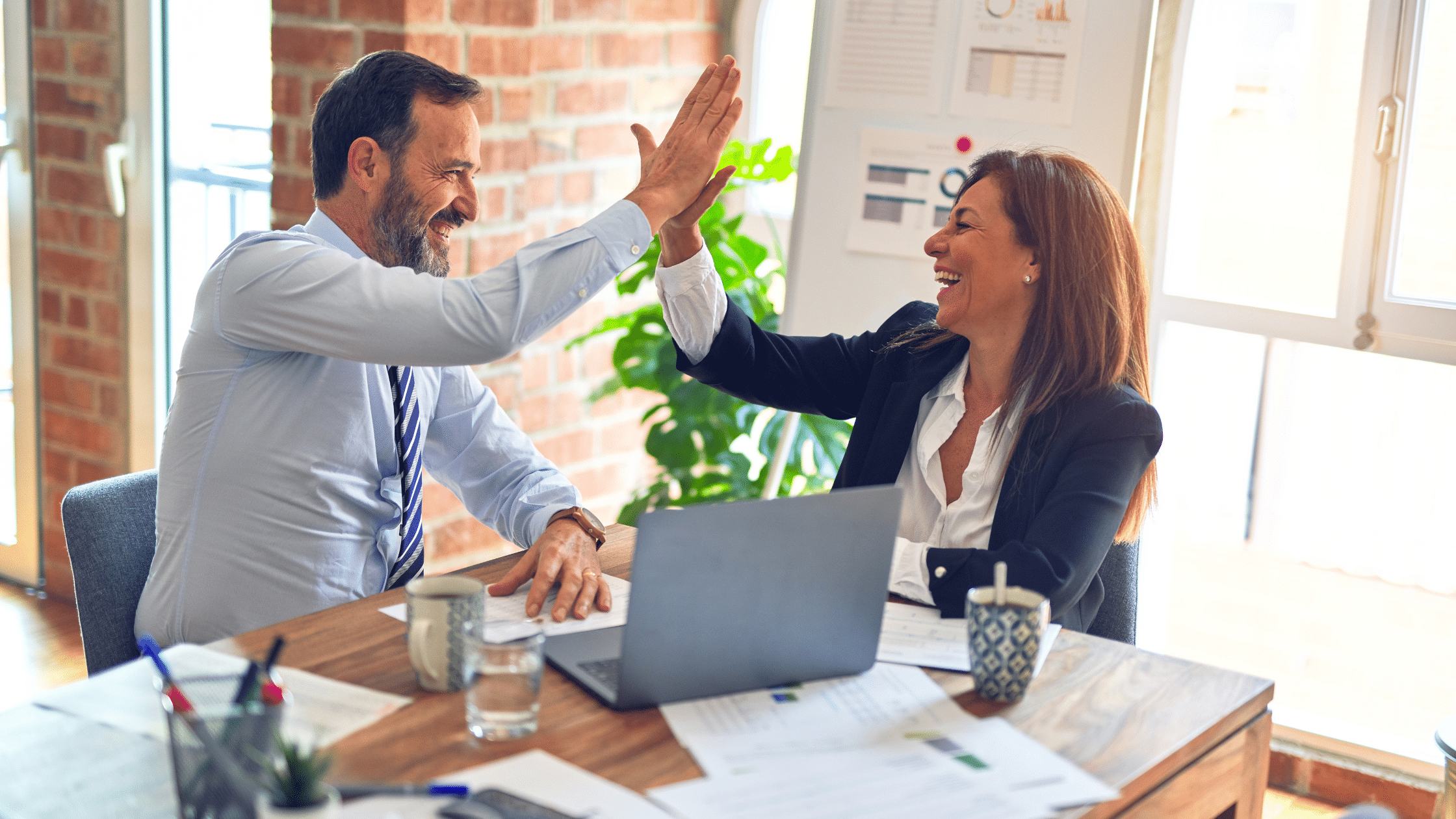 Why Marketing Efforts Fail Without a Strong Sales Strategy man and woman high fiving