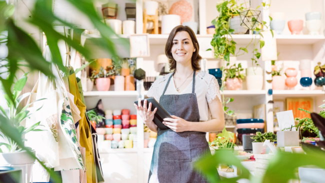 woman in retail store holding a tablet